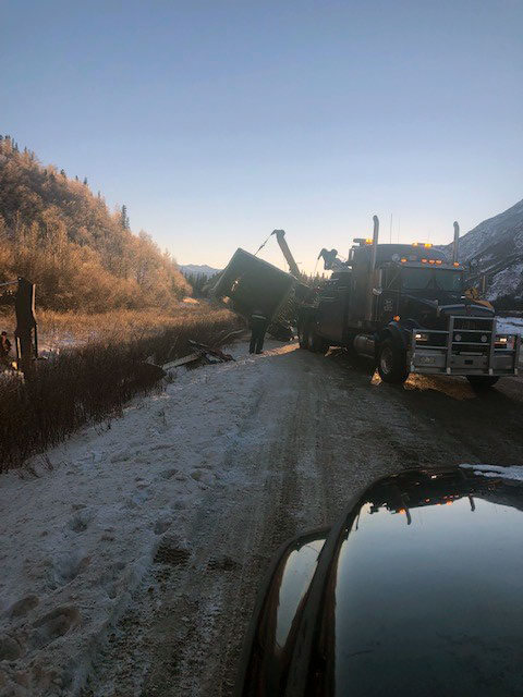 Ben's Towing truck pulls semi out of the ditch.