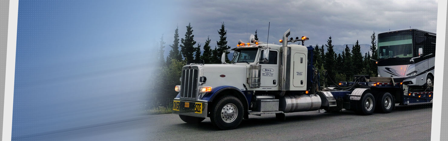 Ben's Towing truck towing motorcoach.