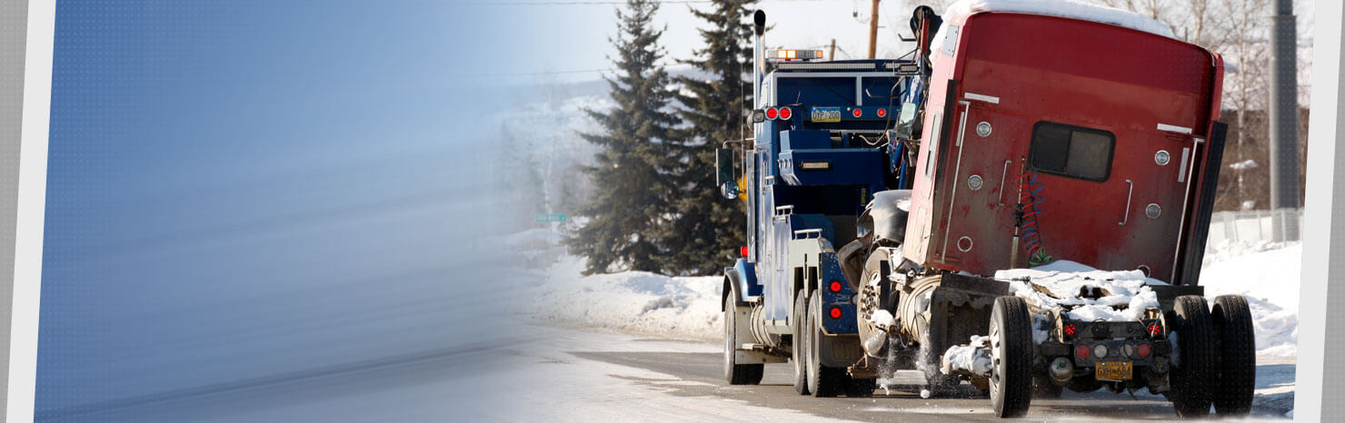 Ben's Towing Truck hauling a vehicle away.